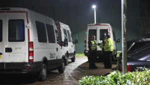 Vans from Capita subsidiary Tascor queue outside Campsfield detention centre to transfer detainees after fire in October 2013