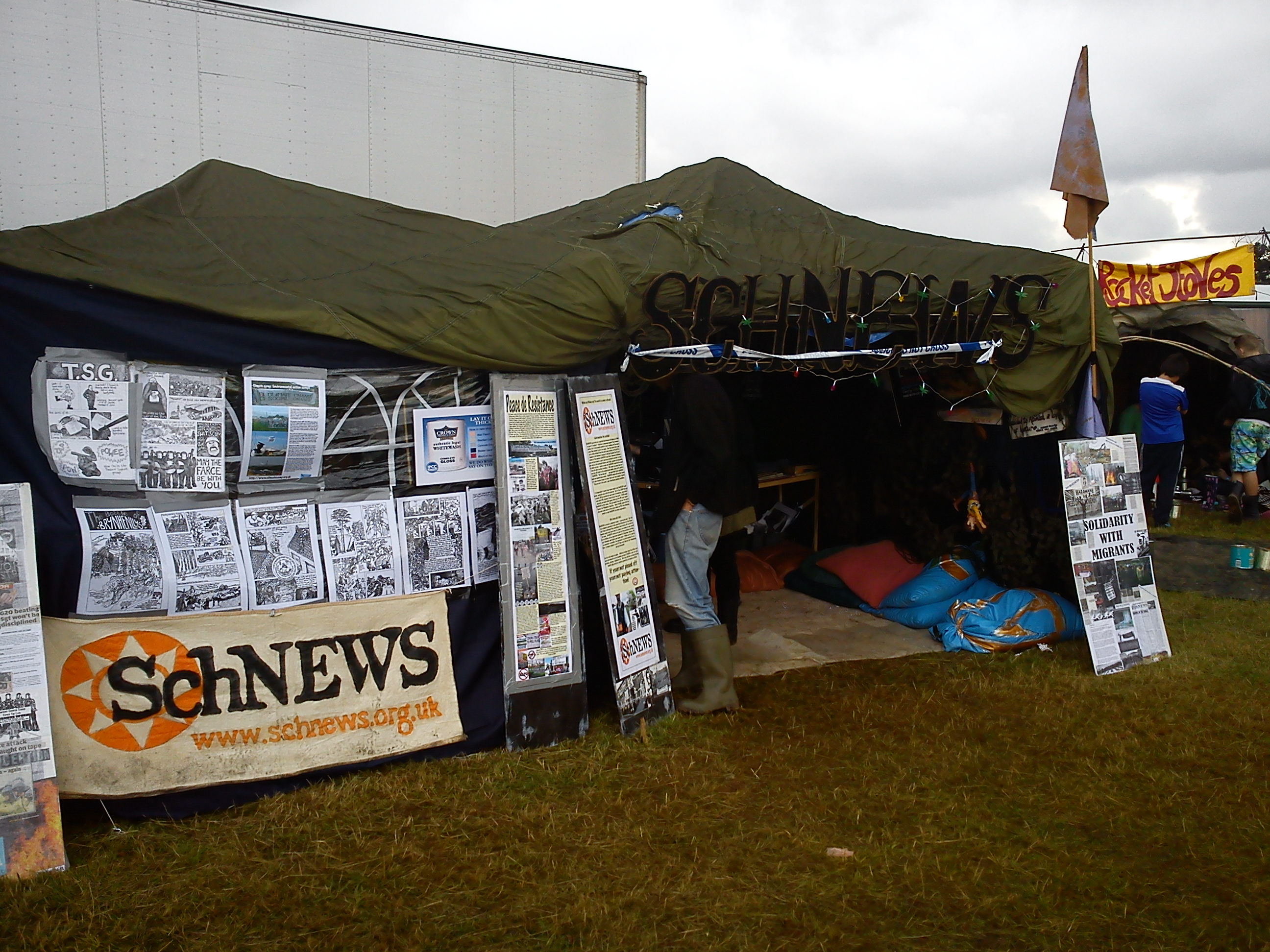 Schnews_stall_at_Boomtown_Festival.jpg