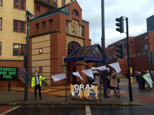 Climate justice campaigners taking part in a demonstration at Leeds Magistrates Court today in support of health and safety charges against Drax Power Station